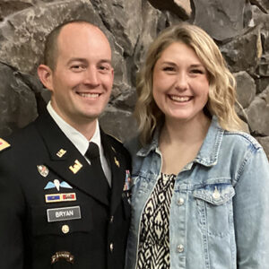 Man in soldier's uniform with his wife.